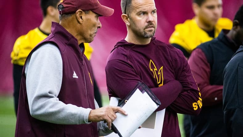 Arizona State University head football coach Herm Edwards speaks with newly hired offensive coordinator Zak Hill during practice at the Verde Dickey Dome on campus in Tempe, Tuesday, December 17, 2019.
Asu Football