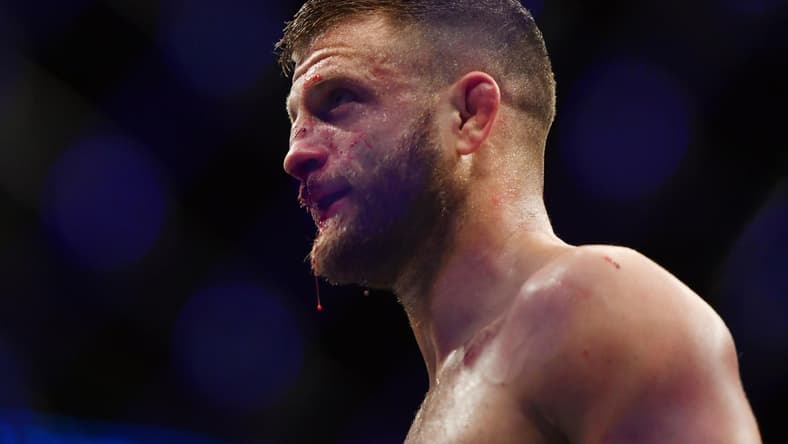 May 9, 2020; Jacksonville, Florida, USA;  Calvin Kattar (blue gloves) defeats Jeremy Stephens (red gloves) during UFC 249 at VyStar Veterans Memorial Arena. Mandatory Credit: Jasen Vinlove-USA TODAY Sports