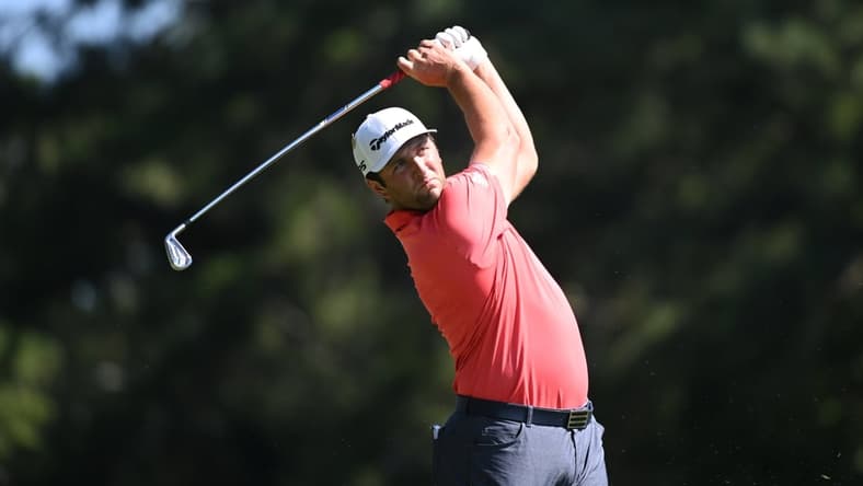 Sep 7, 2020; Atlanta, Georgia, USA; Jon Rahm hits his tee shot on the 9th hole during the final round of the Tour Championship golf tournament at East Lake Golf Club. Mandatory Credit: Adam Hagy-USA TODAY Sports