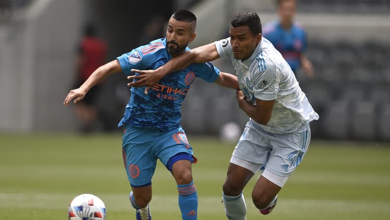 May 29, 2021; Los Angeles, CA, USA; New York City FC midfielder Maxi Moralez (10) moves the ball while pressured by Los Angeles FC defender Eddie Segura (4) during the first half at Banc of California Stadium. Mandatory Credit: Kelvin Kuo-USA TODAY Sports