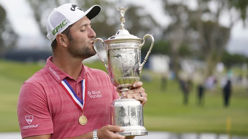 Jun 20, 2021; San Diego, California, USA; Jon Rahm celebrates and kisses the trophy after winning he U.S. Open golf tournament at Torrey Pines Golf Course. Mandatory Credit: Michael Madrid-USA TODAY Sports