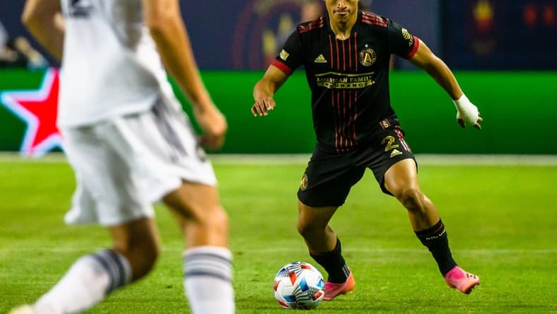 Jul 3, 2021; Chicago, Illinois, USA; Atlanta United defender Ronald Hernandez (2) dribbles the ball against the Chicago Fire during the second half at Soldier Field. Mandatory Credit: Jon Durr-USA TODAY Sports