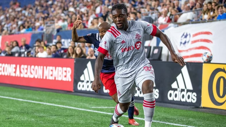 Jul 7, 2021; Foxborough, Massachusetts, USA; Toronto FC forward Ayo Akinola (20) possesses the ball during the first half against the New England Revolution at Gillette Stadium. Mandatory Credit: Paul Rutherford-USA TODAY Sports