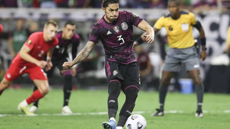 Jul 29, 2021; Houston, Texas, USA; Mexico defender Carlos Salcedo shoots a penalty kick against Canada in the second half during a CONCACAF Gold Cup semifinal soccer match at NRG Stadium. Mandatory Credit: Thomas Shea-USA TODAY Sports