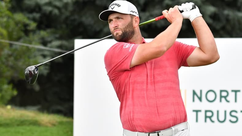 Aug 23, 2021; Jersey City, New Jersey, USA; Jon Rahm watches his tee shot on the ninth hole during the final round of The Northern Trust golf tournament at the Liberty National Golf Club. Mandatory Credit: Mark Konezny-USA TODAY Sports