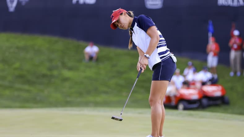 Sep 5, 2021; Toledo, Ohio, USA; Danielle Kang of Team USA putts on the ninth green during competition rounds of the Solheim Cup golf tournament at Inverness Club. Mandatory Credit: Aaron Doster-USA TODAY Sports