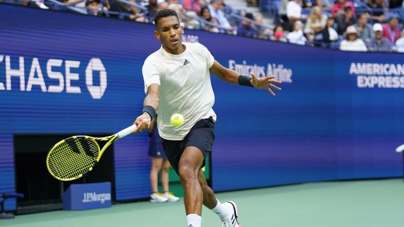 Sep 10, 2021; Flushing, NY, USA; Felix Auger-Aliassime of Canada hits a forehand against Daniil Medvedev of Russia (not pictured) on day twelve of the 2021 U.S. Open tennis tournament at USTA Billie Jean King National Tennis Center. Mandatory Credit: Danielle Parhizkaran-USA TODAY Sports