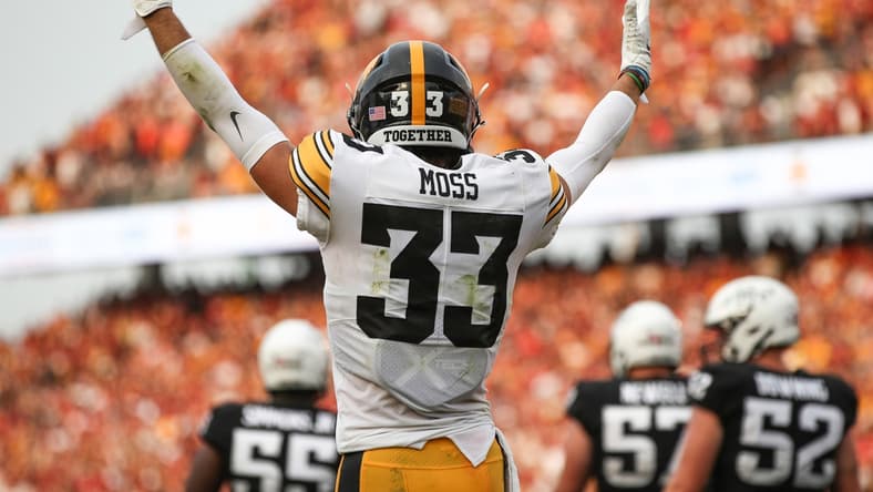 Sep 11, 2021; Ames, Iowa, USA; Iowa Hawkeyes defensive back Riley Moss (33) celebrates after a Hawkeyes touchdown against the Iowa State Cyclones in the third quarter at Jack Trice Stadium. The Hawkeyes won 27-17.  Mandatory Credit: Reese Strickland-USA TODAY Sports