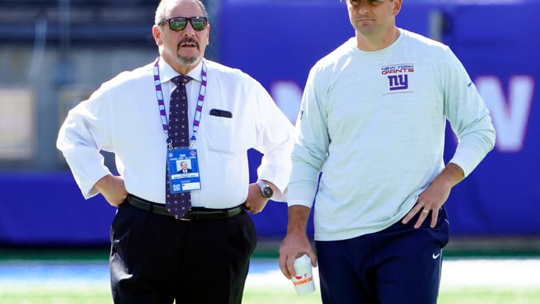 New York Giants general manager Dave Gettleman, left, and head coach Joe Judge talk on the field before the game at MetLife Stadium on Sunday, Sept. 26, 2021, in East Rutherford.

Nyg Vs Atl