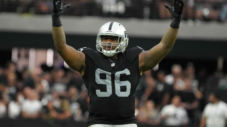 Sep 26, 2021; Paradise, Nevada, USA; Las Vegas Raiders defensive tackle Darius Philon (96) celebrates in the second half against the Miami Dolphinsat Allegiant Stadium.The Raiders defeated the Dolphins 31-28 in overtime. Mandatory Credit: Kirby Lee-USA TODAY Sports