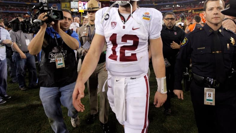Stanford's Andrew Luck (12) walks of the field after losing the Fiesta Bowl between the Oklahoma State University Cowboys (OSU) and the Stanford Cardinal at the University of Phoenix Stadium in Glendale, Ariz., Tuesday, Jan. 3, 2012.

Osu101