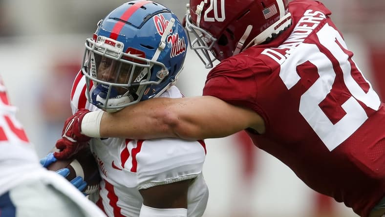 Oct 2, 2021; Tuscaloosa, Alabama, USA;  Alabama linebacker Drew Sanders (20) wraps up Ole Miss wide receiver Dontario Drummond (11) at Bryant-Denny Stadium. Mandatory Credit: Gary Cosby-USA TODAY Sports