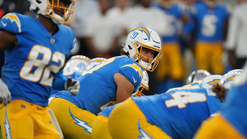 Oct 4, 2021; Inglewood, California, USA; Los Angeles Chargers quarterback Justin Herbert (10) prepares to take the snap against the Las Vegas Raiders at SoFi Stadium. The Chargers defeated the Raiders 28-14. Mandatory Credit: Kirby Lee-USA TODAY Sports