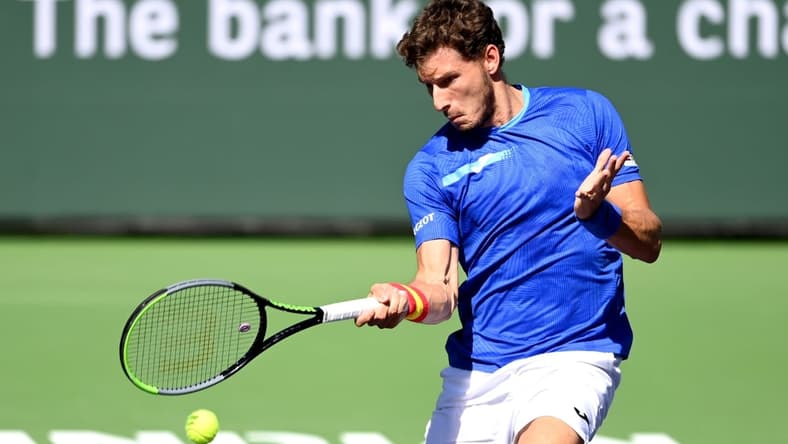 Oct 12, 2021; Indian Wells, CA, USA; Pablo Carreno Busta (ESP) hits a shot against Karen Khachanov (RUS) during a fourth round match in the BNP Paribas Open at the Indian Wells Tennis Garden. Mandatory Credit: Jayne Kamin-Oncea-USA TODAY Sports