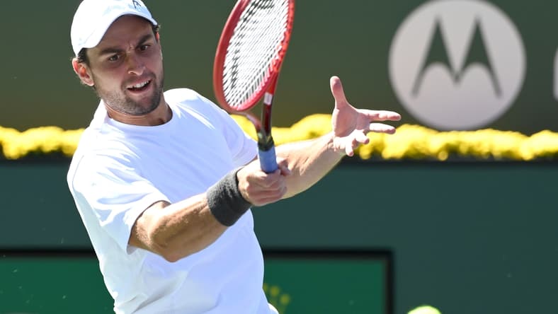 Oct 13, 2021; Indian Wells, CA, USA; Aslan Karatsev (RUS) hits a shot during his fourth round match against Hubert Hurkacz (POL) during the BNP Paribas Open at the Indian Wells Tennis Garden. Mandatory Credit: Jayne Kamin-Oncea-USA TODAY Sports