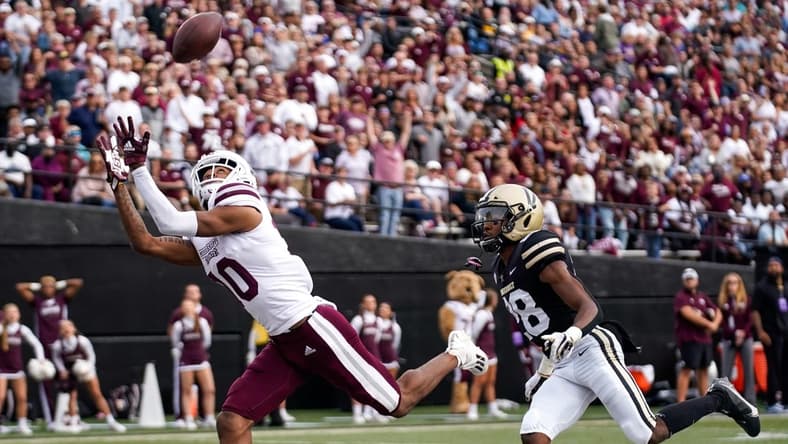 Mississippi State wide receiver Makai Polk (10) receives a pass for a touchdown past Vanderbilt cornerback Allan George (28) during the second quarter at Vanderbilt Stadium in Nashville, Tenn., Saturday, Oct. 23, 2021.
Vandy Missst Fb 102321 An 008
