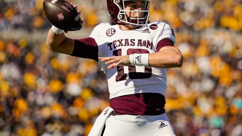 Oct 16, 2021; Columbia, Missouri, USA; Texas A&M Aggies quarterback Zach Calzada (10) warms up during a timeout in the first half against the Missouri Tigers at Faurot Field at Memorial Stadium. Mandatory Credit: Jay Biggerstaff-USA TODAY Sports