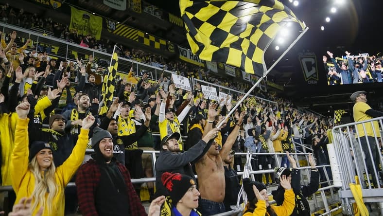 Oct 27, 2021; Columbus, Ohio, USA; Columbus Crew fans in the Nordecke celebrate following a 3-2 victory over Orlando City at Lower.com Field. Mandatory Credit: Adam Cairns/Columbus Dispatch via USA TODAY NETWORK