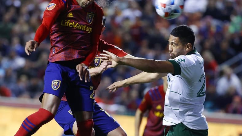 Nov 3, 2021; Sandy, Utah, USA; Real Salt Lake midfielder Everton Luiz (25) heads the ball for a shot against Portland Timbers defender Bill Tuiloma (25) in the first half at Rio Tinto Stadium. Mandatory Credit: Jeffrey Swinger-USA TODAY Sports