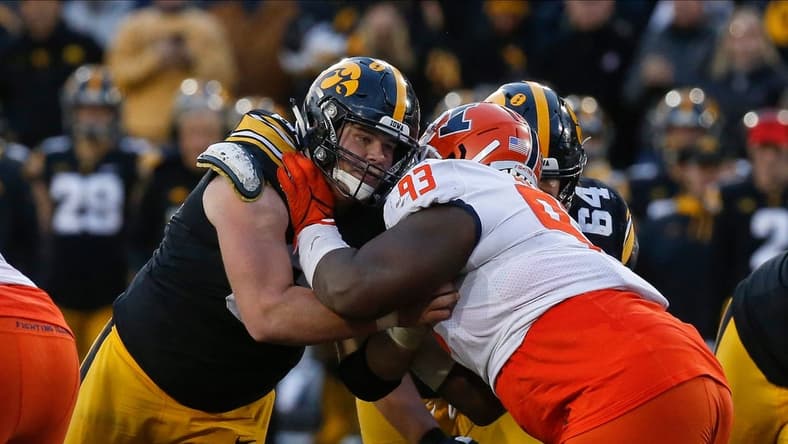 Iowa junior center Tyler Linderbaum battles Illinois junior defensive lineman Calvin Avery during a drive in the fourth quarter on Saturday, Nov. 20, 2021, at Kinnick Stadium in Iowa City, Iowa.

20211120 Iowavsillinois
