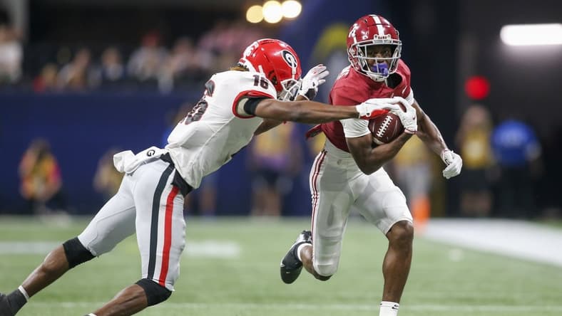 Dec 4, 2021; Atlanta, GA, USA; Alabama Crimson Tide wide receiver Ja'Corey Brooks (7) is tackled by Georgia Bulldogs defensive back Lewis Cine (16) in the second half during the SEC championship game at Mercedes-Benz Stadium. Mandatory Credit: Brett Davis-USA TODAY Sports