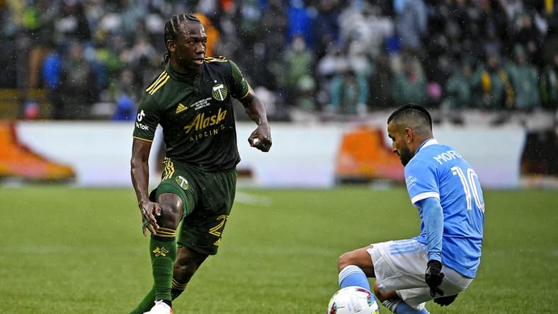 Dec 11, 2021; Portland, OR, USA; Portland Timbers midfielder Diego Chara (21) kicks the ball against New York City FC midfielder Maximiliano Moralez (10) during the first half in the 2021 MLS Cup championship game at Providence Park. Mandatory Credit: Troy Wayrynen-USA TODAY Sports