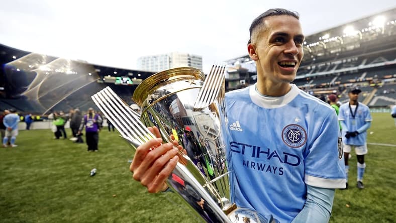 Dec 11, 2021; Portland, OR, USA; New York City FC's Jesus Medina (19) celebrates with the MLS Cup after beating the Portland Timbers in the 2021 MLS Cup championship game at Providence Park. Mandatory Credit: Soobum Im-USA TODAY Sports