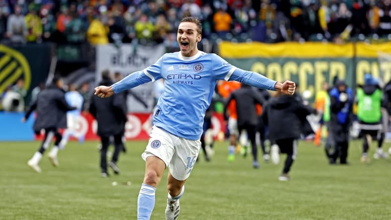 Dec 11, 2021; Portland, OR, USA; New York City FC midfielder James Sands (16) celebrates after beating the Portland Timbers in the 2021 MLS Cup championship game at Providence Park. Mandatory Credit: Soobum Im-USA TODAY Sports