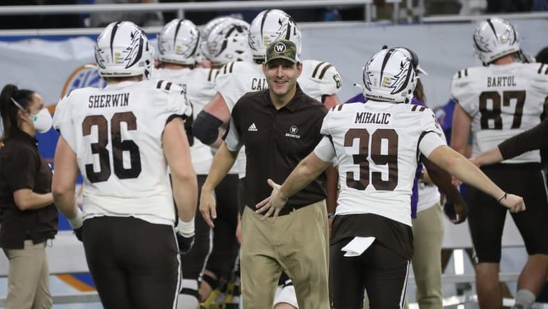 Western Michigan head coach Tim Lester congratulates his players Monday, Dec. 27, 2021, during the Broncos' 52-24 win over the Nevada Wolf Pack in the Quick Lane Bowl at Ford Field.
Quick Lane
