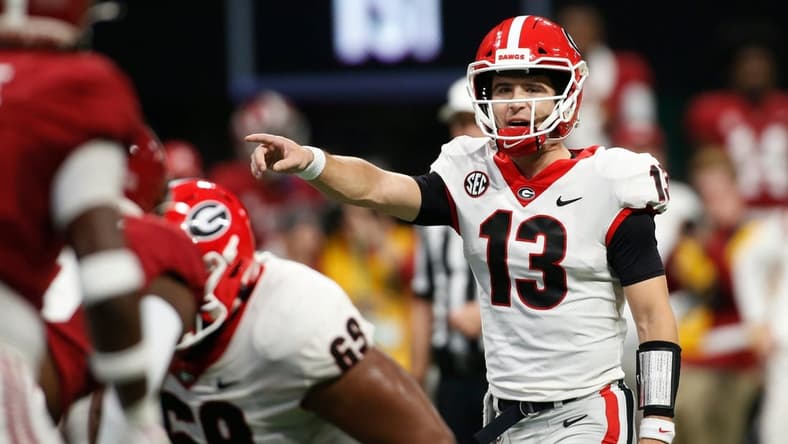 Georgia quarterback Stetson Bennett (13) gets set to run a play during the first half of the Southeastern Conference championship NCAA college football game between Georgia and Alabama in Atlanta, on Saturday, Dec. 4, 2021.

News Joshua L Jones

Syndication Online Athens

Syndication Palm Beach Post