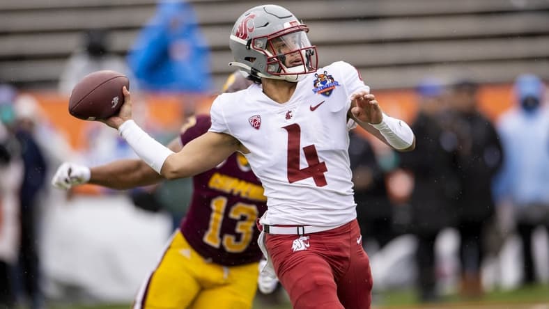 Dec 31, 2021; El Paso, Texas, USA; Washington State Cougars quarterback Jayden de Laura (4) drops back to pass the ball against the Central Michigan Chippewas defense in the 88th annual Sun Bowl football game at Sun Bowl Stadium. Mandatory Credit: Ivan Pierre Aguirre-USA TODAY Sports