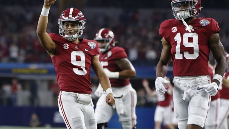 Dec 31, 2021; Arlington, Texas, USA; Alabama Crimson Tide quarterback Bryce Young (9) reacts after throwing a touchdown in the fourth quarter against the Cincinnati Bearcats during the 2021 Cotton Bowl college football CFP national semifinal game at AT&T Stadium. Mandatory Credit: Tim Heitman-USA TODAY Sports