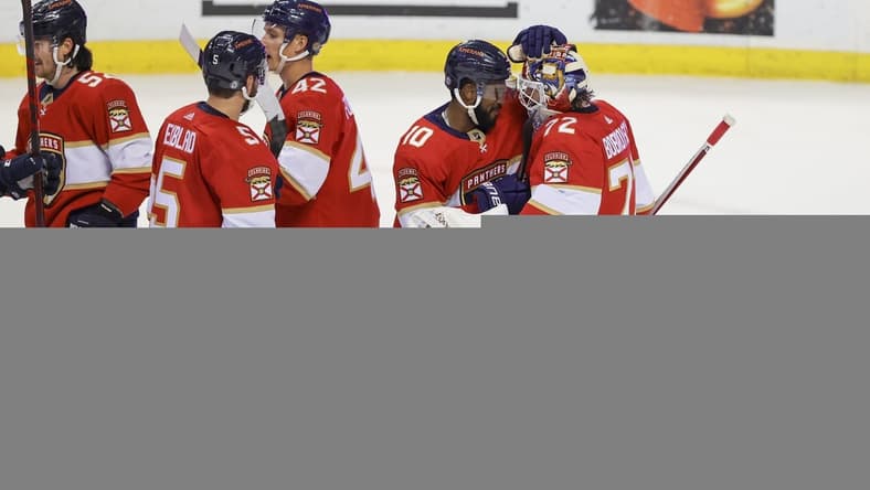 Jan 1, 2022; Sunrise, Florida, USA; Florida Panthers left wing Anthony Duclair (10) and goaltender Sergei Bobrovsky (72) celebrate after winning the game against the Montreal Canadiens at FLA Live Arena. Mandatory Credit: Sam Navarro-USA TODAY Sports