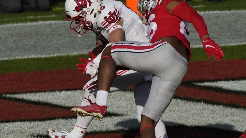 Jan 1, 2022; Pasadena, California, USA; Utah Utes wide receiver Britain Covey (18) scores a touchdown past Ohio State Buckeyes cornerback Cameron Brown (26) during the  first quarter of the 2022 Rose Bowl at Rose Bowl. Mandatory Credit: Robert Hanashiro-USA TODAY Sports