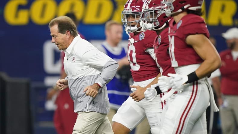Alabama Head Coach Nick Saban leads players onto the field before the 2021 College Football Playoff Semifinal game at the 86th Cotton Bowl in AT&T Stadium in Arlington, Texas Friday, Dec. 31, 2021. Alabama defeated Cincinnati 27-6 to advance to the national championship game. [Staff Photo/Gary Cosby Jr.]

College Football Playoffs Alabama Vs Cincinnati