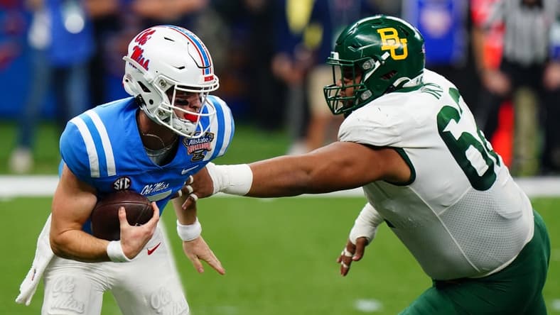 Jan 1, 2022; New Orleans, LA, USA; Baylor Bears defensive tackle Siaki Ika (62) reaches for Mississippi Rebels quarterback Luke Altmyer (7) during the first half in the 2022 Sugar Bowl at Caesars Superdome. Mandatory Credit: John David Mercer-USA TODAY Sports