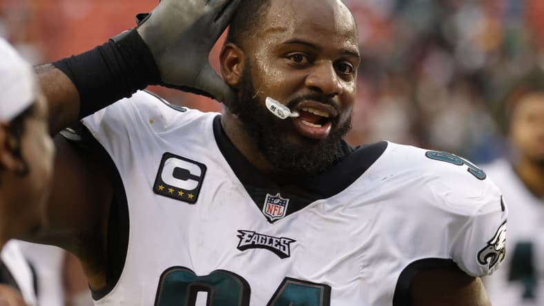 Jan 2, 2022; Landover, Maryland, USA; Philadelphia Eagles defensive tackle Fletcher Cox (91) celebrates while leaving the field after the game against the Washington Football Team at FedExField. Mandatory Credit: Geoff Burke-USA TODAY Sports