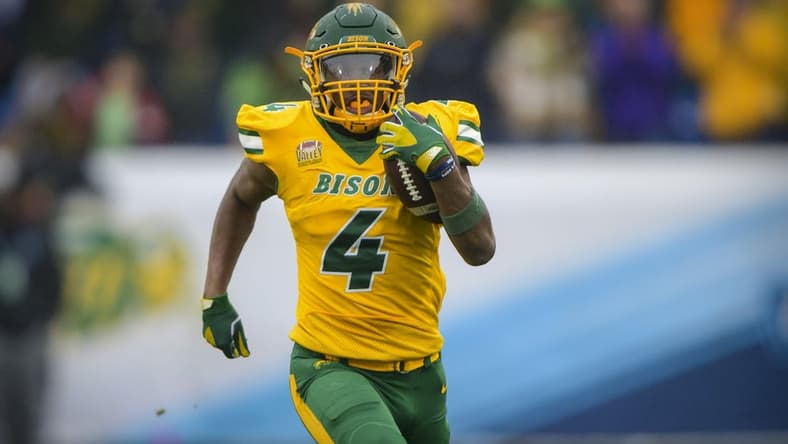 Jan 8, 2022; Frisco, TX, USA; North Dakota State Bison running back Kobe Johnson (4) rushes for a touchdown against the Montana State Bobcats during the first half of the FCS Championship at Toyota Stadium. Mandatory Credit: Jerome Miron-USA TODAY Sports