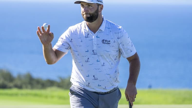 January 8, 2022; Maui, Hawaii, USA; Jon Rahm acknowledges the crowd after making his putt on the 10th hole during the third round of the Sentry Tournament of Champions golf tournament at Kapalua Resort - The Plantation Course. Mandatory Credit: Kyle Terada-USA TODAY Sports