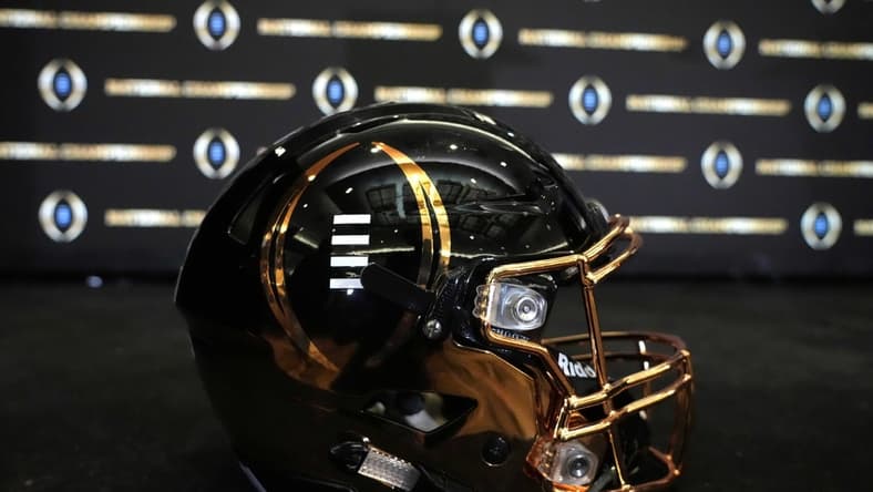 Jan 11, 2022; Indianapolis, Indiana, USA; A detailed view of College Football Playoff National Championship logo helmet at  2022 Indianapolis Host Committee press conference at the JW Marriott. Mandatory Credit: Kirby Lee-USA TODAY Sports