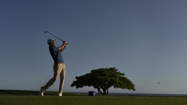 January 15, 2022; Honolulu, Hawaii, USA; Russell Henley hits his tee shot on the 17th hole during the third round of the Sony Open in Hawaii golf tournament at Waialae Country Club. Mandatory Credit: Kyle Terada-USA TODAY Sports