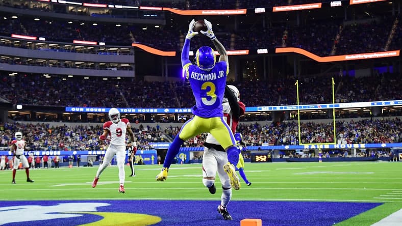 Jan 17, 2022; Inglewood, California, USA; Los Angeles Rams wide receiver Odell Beckham Jr. (3) catches a touchdown pass against Arizona Cardinals cornerback Marco Wilson (20) during the first half in the NFC Wild Card playoff football game at SoFi Stadium. Mandatory Credit: Gary A. Vasquez-USA TODAY Sports