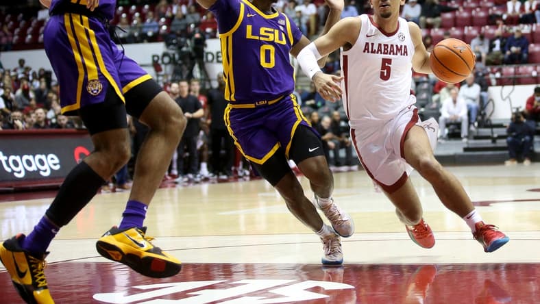 Alabama guard Jaden Shackelford (5) drives into the lane past LSU guard Brandon Murray (0) in Coleman Coliseum on the campus of the University of Alabama Wednesday, Jan. 19, 2022.

Sec Men S Basketball Alabama Vs Lsu