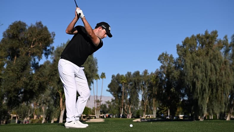 Jan 20, 2022; La Quinta, California, USA; Patrick Cantlay plays his shot from the 15th tee during the first round of the American Express golf tournament at La Quinta Country Club. Mandatory Credit: Orlando Ramirez-USA TODAY Sports