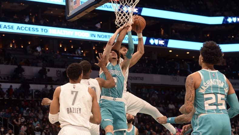 Jan 21, 2022; Charlotte, North Carolina, USA;  Charlotte Hornets guard LaMelo Ball (2) fights for a rebound during the first half against the Oklahoma City Thunder at The Spectrum Center. Mandatory Credit: Sam Sharpe-USA TODAY Sports