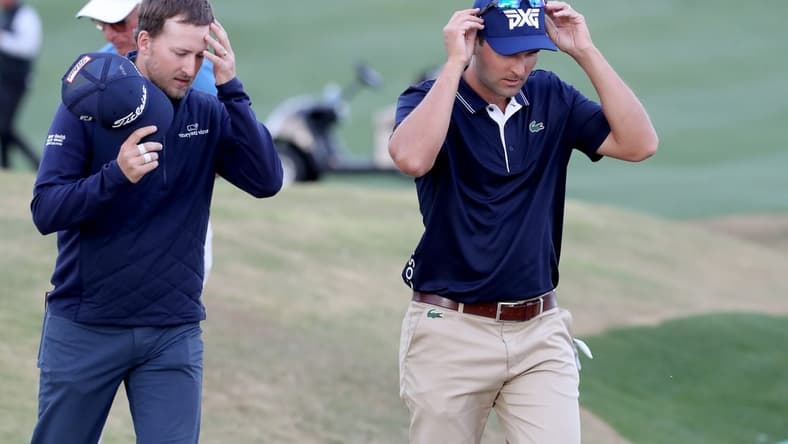 Lee Hodges, left, and Paul Barjon finish on the 9th green of the Pete Dye Stadium Course at PGA West during round three of The American Express in La Quinta, Calif., on Saturday, Jan. 22, 2022.

Barjon And Hodges American Express Round Three3531