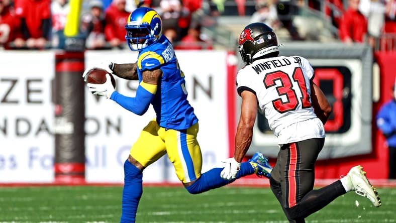 Jan 23, 2022; Tampa, Florida, USA; Los Angeles Rams wide receiver Odell Beckham Jr. (3) run the ball against Tampa Bay Buccaneers safety Antoine Winfield Jr. (31) during the first half in a NFC Divisional playoff football game at Raymond James Stadium. Mandatory Credit: Matt Pendleton-USA TODAY Sports
