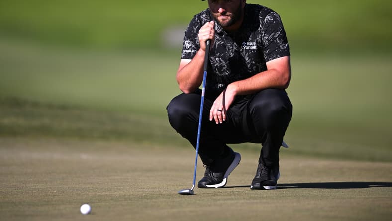 Jan 27, 2022; San Diego, California, USA; Jon Rahm lines up a putt on the ninth green during the second round of the Farmers Insurance Open golf tournament at Torrey Pines Municipal Golf Course - North Course. Mandatory Credit: Orlando Ramirez-USA TODAY Sports