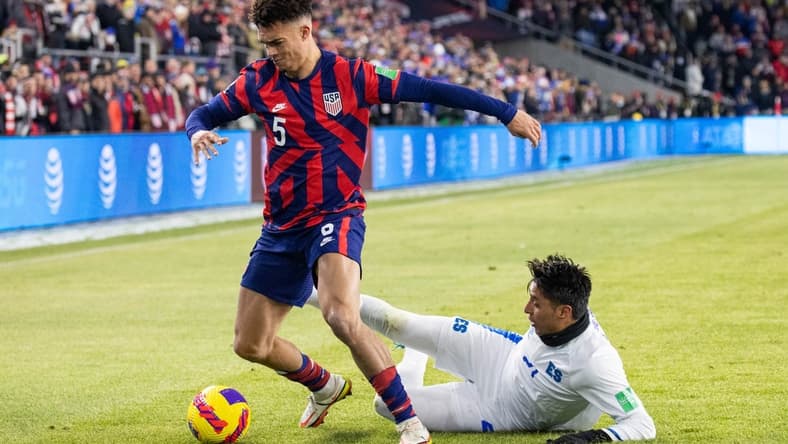 Jan 27, 2022; Columbus, Ohio, USA; United States defender Antonee Robinson (5) dribbles the ball while El Salvador defender Bryan Tamacas (21) defends during a CONCACAF FIFA World Cup Qualifier soccer match at Lower.com Field. Mandatory Credit: Trevor Ruszkowski-USA TODAY Sports