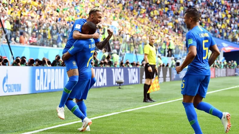 Jun 22, 2018; Saint Petersburg, Russia; Brazil forward Neymar (10), midfielder Casemiro (5) and forward Douglas Costa (7) celebrate after a goal against Costa Rica in Group E play during the FIFA World Cup 2018 at Saint Petersburg Stadium. Mandatory Credit: Tim Groothuis/Witters Sport via USA TODAY Sports